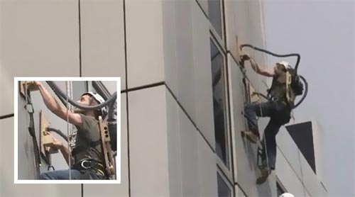 Man Climbs Building Using DIY Vacuum Gloves